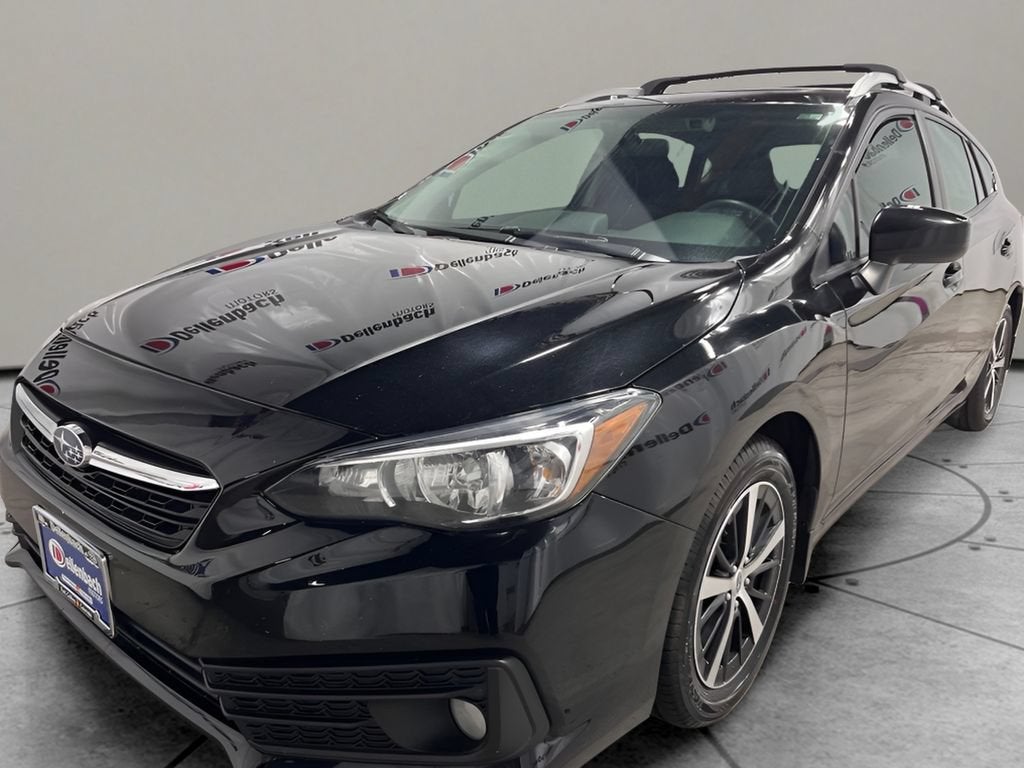 2023 Subaru Impreza Premium in Crystal Black Sil — front three-quarter view